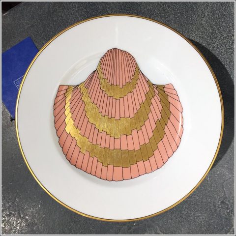 Set of coral and gold shell-design dessert plates.